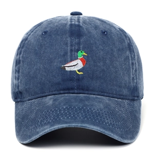 Detailed close-up of wild duck embroidery on a washed navy denim baseball cap