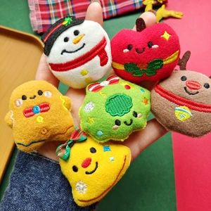 Plush Christmas ornaments set featuring snowman, reindeer, and gingerbread man figurines