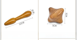Close-up of wooden massage tools including a gourd stick and a hexagonal block