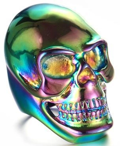 Macro shot of iridescent skull ring in 316L stainless steel with punk gothic design