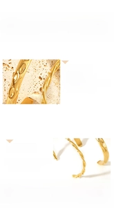 Macro shot of 18K gold plated stainless steel bracelet featuring fluid hammer textures and zircons