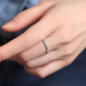 Minimalist gold ring featuring a multi-colored cubic zirconia row design for women