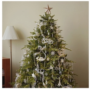 Close-up of a Christmas tree star topper with golden finish and warm LED light strings