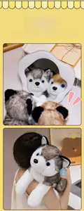 Detailed view of grey and brown husky plush toy showing size and soft texture