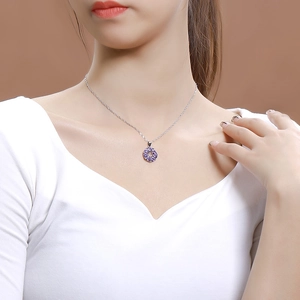 Elegant 925 sterling silver necklace with purple cubic zirconia pendant on model