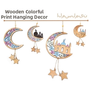 Detail of wooden Ramadan hanging ornaments with moon and mosque silhouette cutout designs