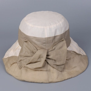 Detailed back view of a ramie sun hat showing a large elegant bow and woven texture