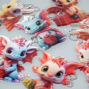 Colorful acrylic cartoon dragon ornaments with gift boxes and metal bead chains