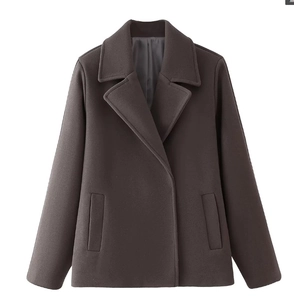 Detail of taupe double-breasted wool coat with notch lapels and side pockets
