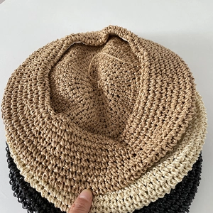 Handmade crochet beret for women in khaki, beige and black colors with soft woven texture