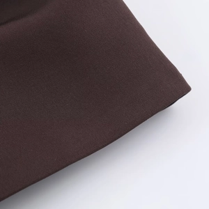 Detailed macro view of deep brown woven fabric texture with durable pleated structure