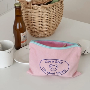 Cute pink canvas bear storage pouch with zipper and Live a Good Life inscription