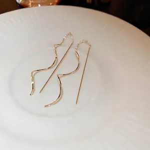 Minimalist gold spiral chain earrings with sleek wavy design for modern daily wear
