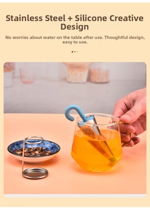 Close-up of umbrella-shaped tea infuser with blue silicone handle and stainless steel stand
