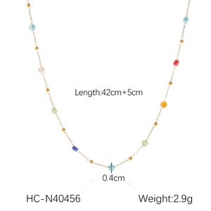 Detail view of gold stainless steel necklace with colored beads and 42cm+5cm length specs