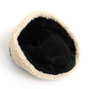 Warm corduroy baby hat with thick black fleece lining and cream faux shearling trim