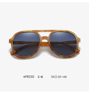 Close-up of retro aviator polarized sunglasses with amber tortoise shell frame and double bridge