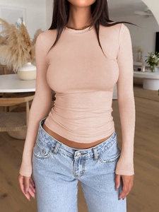 Detail of slim fit long sleeve shirt in nude color with soft cotton texture