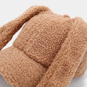 Close-up of caramel brown lamb wool baseball cap showing soft fuzzy texture detail