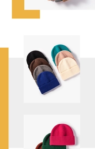 Detailed stack of multi-color ribbed knit beanies showcasing various vibrant hues