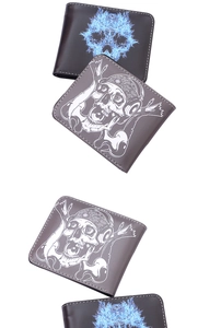 Detail of men's bifold wallets featuring vintage skull prints and fine stitching detail