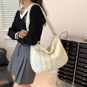 Chic cream quilted puffer tote bag in large capacity for women with stylish crossbody strap