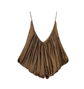 Close-up of gathered neckline detail on brown satin camisole with silk texture