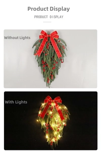 Detail showing artificial red berry Christmas swag with velvet bow and warm LED lights