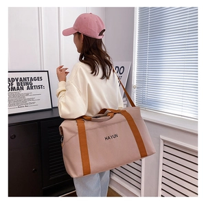 Detailed view of large capacity yoga fitness bag with HAYUN logo and sturdy nylon straps