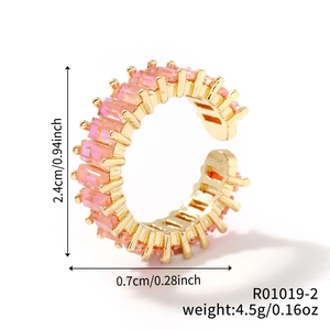 Detail view of gold open ring with pink rectangle gem including size and weight specs