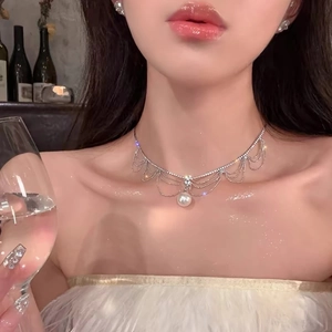 Exaggerated multi-layer silver fringe necklace with pearl pendant and rhinestones