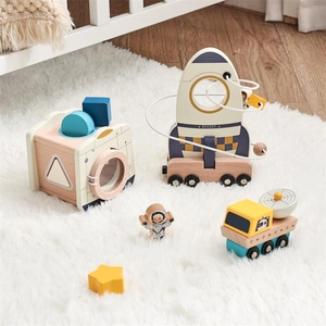 Detailed close-up of wooden rocket stacking toy set with space-themed educational accessories