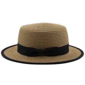 Flat top straw sun hat with black ribbon bow and edged brim for summer beach vacation
