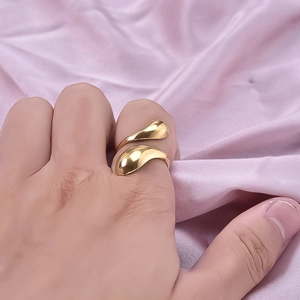 Minimalist 304 stainless steel irregular gold teardrop open ring on a silk background