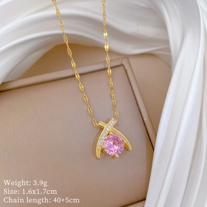 Detail of pink crystal teardrop pendant on gold chain with dimensions and weight info
