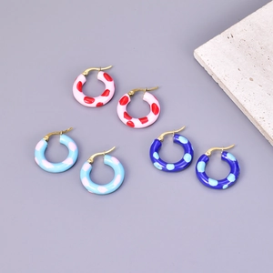 Three pairs of colorful enamel hoop earrings with polka dot patterns and 18k gold plating