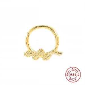Detail of golden S925 sterling silver seamless ring with unique wavy snake texture