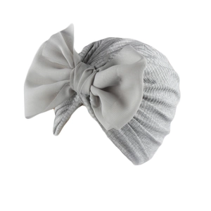 Detail of grey ribbed baby turban hat featuring a large chiffon bow decoration