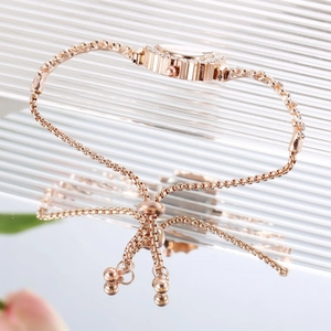 Montre bracelet fleur or rose pour femme avec fermoir bolo réglable et cristaux