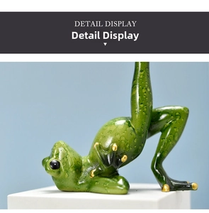 Macro shot of green yoga frog resin decor with golden toe accents and glazed texture