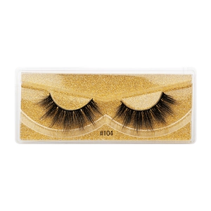 Detail of 3D faux mink eyelashes style #104 on gold glitter tray in clear packaging