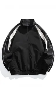 Detail of windproof black sport jacket with white contrast stripes and stand collar