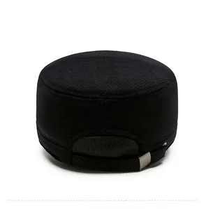 Detail of black military flat top hat with adjustable metal buckle and ribbed trim