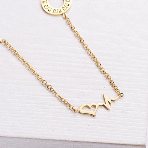Elegant gold necklace with heart heartbeat pendant and Greek fret meander motif