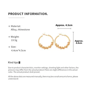 Detail view showing size 4.4cm x 4.5cm of gold alloy hoop earrings with sparkling rhinestones