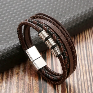 Close-up of multilayered brown and black leather bracelet with silver metal beads