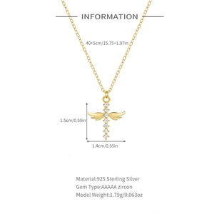 Detailed view of gold cross necklace with angel wings, zircon stones and S925 silver specs