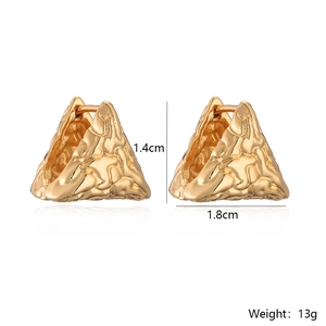 Macro detail of gold geometric triangle earrings with dimensions 1.4cm by 1.8cm