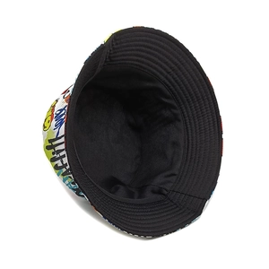 Detailed macro view of graffiti patterned cotton canvas bucket hat showing stitching quality