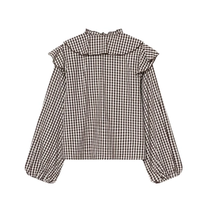 Fashionable black and white plaid cotton blouse with ruffled collar and puff sleeves